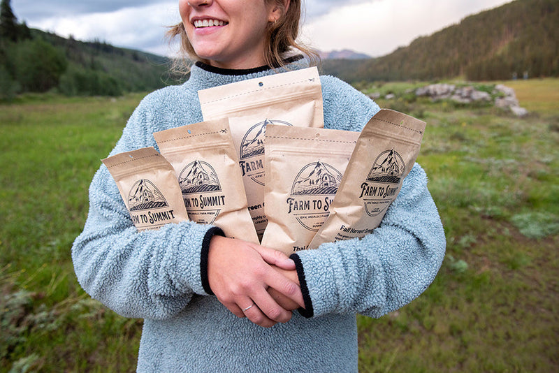 Satisfied Customer Holding Farm To Summit Dehydrated Camp Meals In the Colorado Backcountry