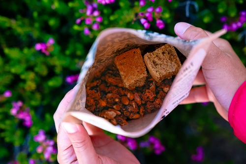 Handheld picture of Farm To Summit's Three Bean Chili & Cornbread in the Colorado backcountry. 